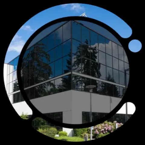 Dinoustech app services - modern glass building