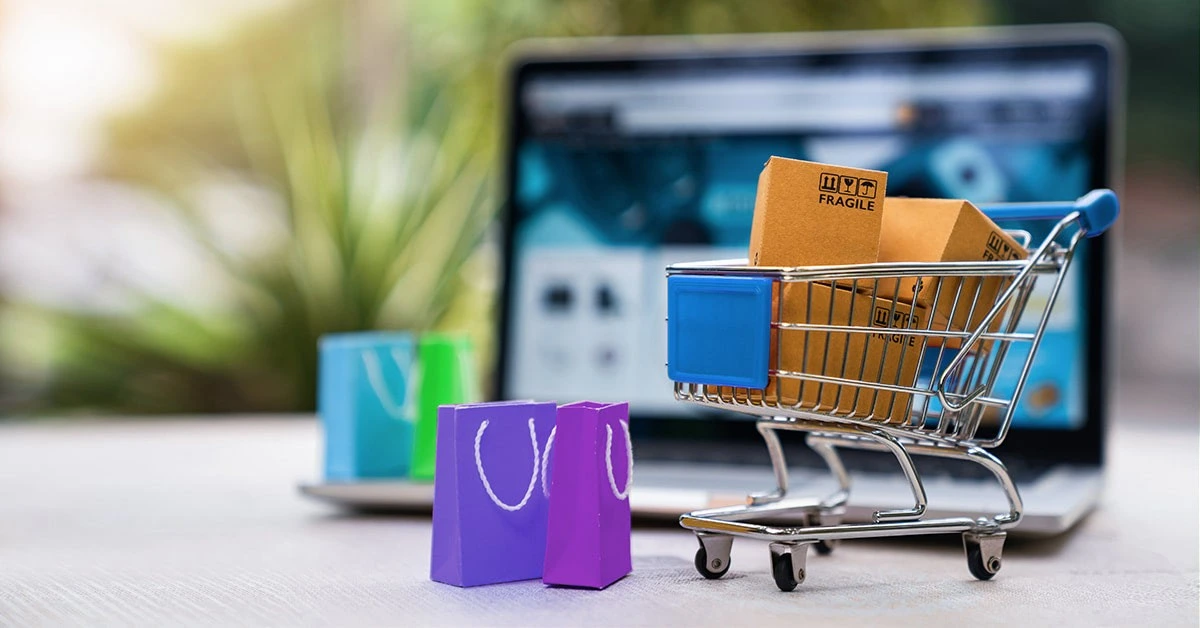 Shopping cart icon displayed on a laptop screen, symbolizing e-commerce integration in website development.